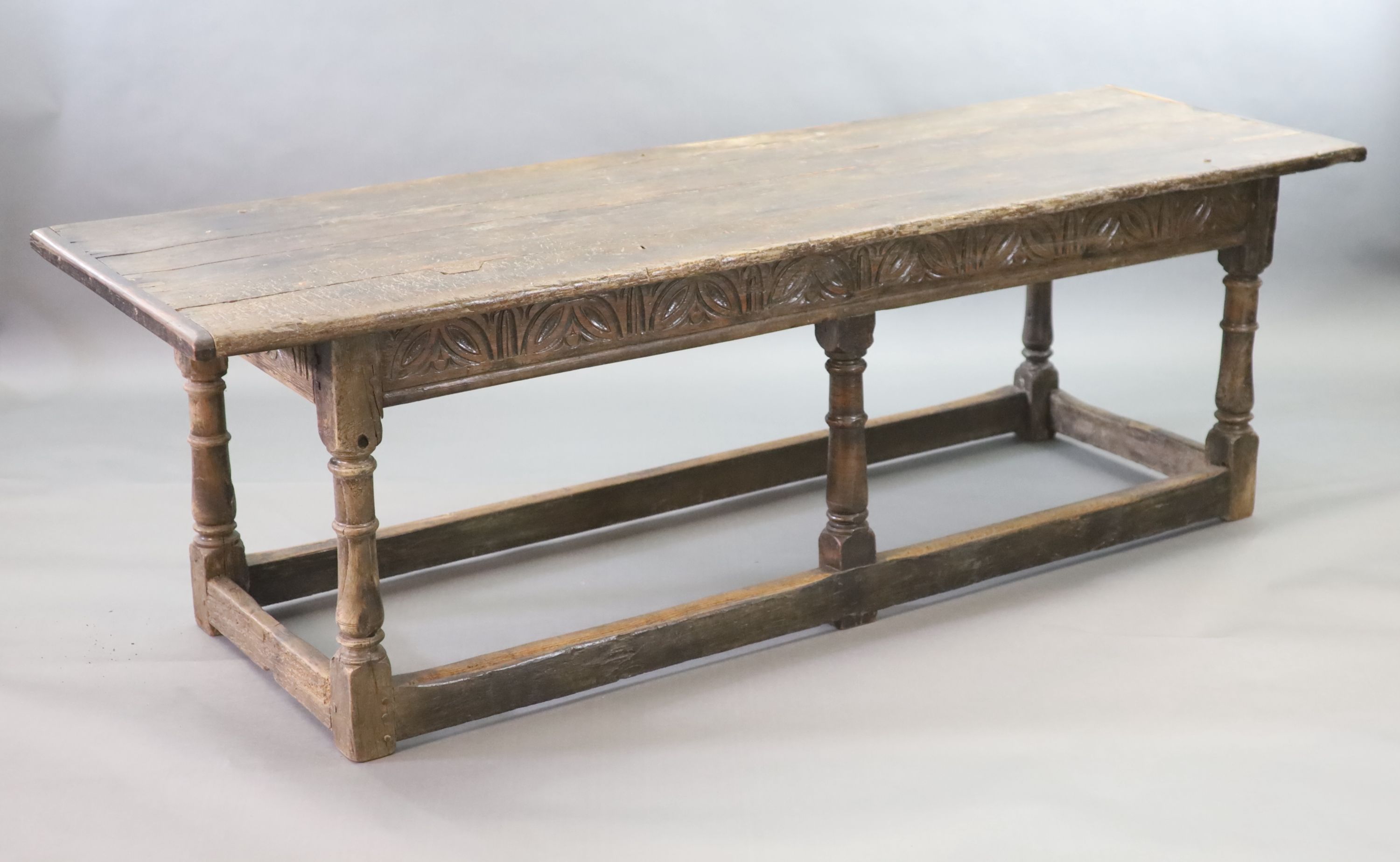 A 17th century oak and elm refectory table, L.255cm W.82cm H.78cm